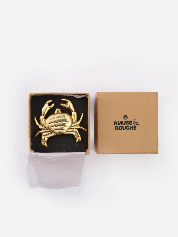 Crab-shaped brass cabinet knob, close-up detail