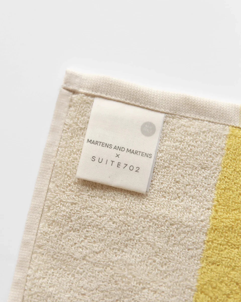 Sunny yellow and pink beach towel, folded