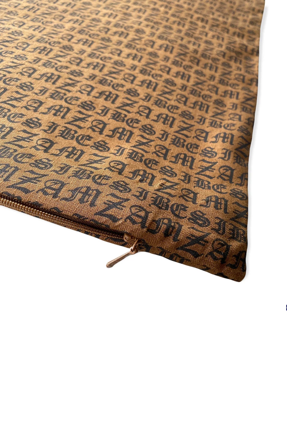 Zambesi Hallmark cushion in clay, close-up of linen print