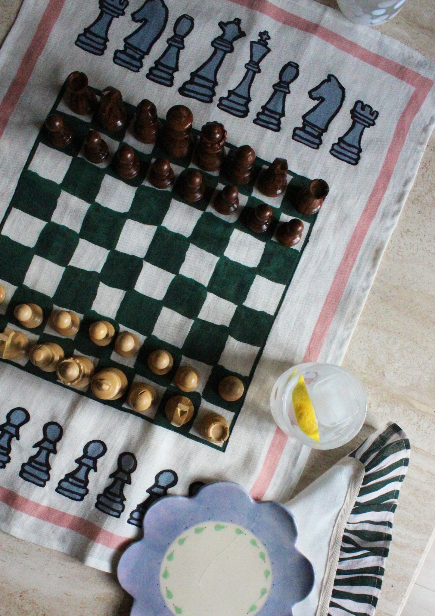 Chess board print linen tea towel, close-up of embroidery detail