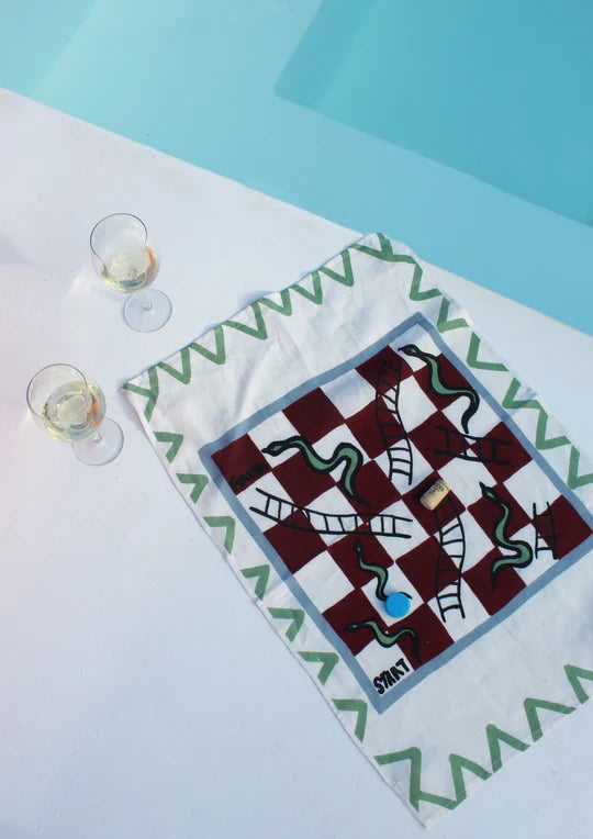 Snakes and ladders board print linen tea towel, close-up of embroidery detail