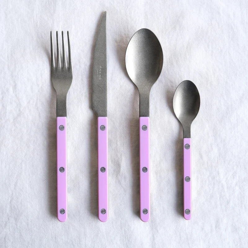 Sabre Paris Vintage Bistrot 4-piece cutlery set in pink, styled on table