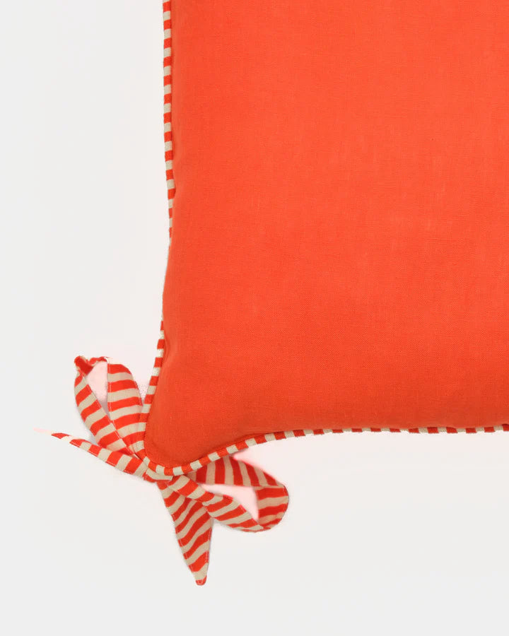 Hot orange ribbon trim linen cushion cover, close-up of ribbon detail