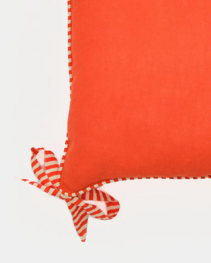 Hot orange ribbon trim linen cushion cover, close-up of ribbon detail
