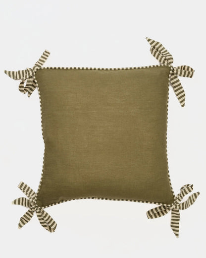 Olive ribbon trim linen cushion cover on a sofa