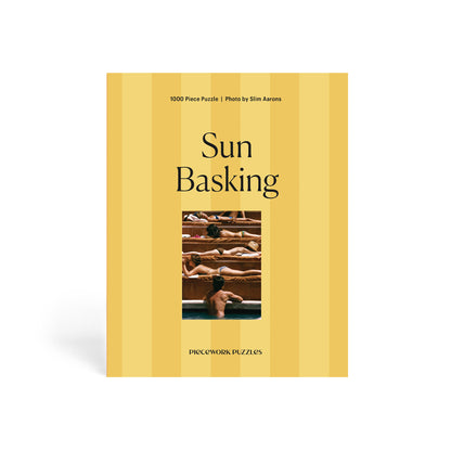 Puzzle box titled 'Sun Basking' with a photo of people sunbathing on a yellow background.